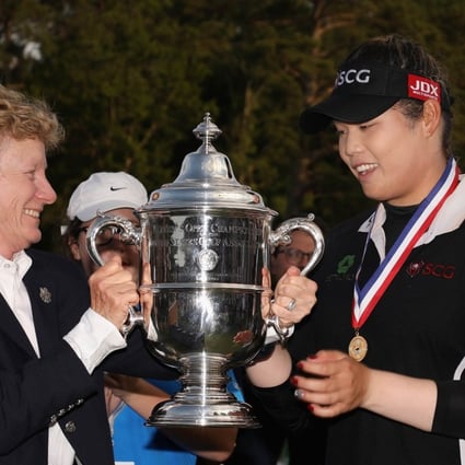 Ariya Jutanugarn of Thailand is awarded the 2018 US Women’s Open trophy after winning in a play-off. Photo: AFP