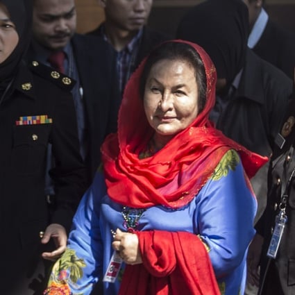 Rosmah Mansor is escorted by authorities as she arrives at the Malaysian Anti-Corruption Commission (MACC) headquarters. Photo: EPA
