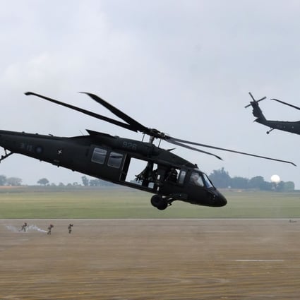 UH-60 Black Hawk helicopters take part in the Han Kuang drills at the Ching Chuan Kang airbase in Taichung on Thursday. Photo: AFP