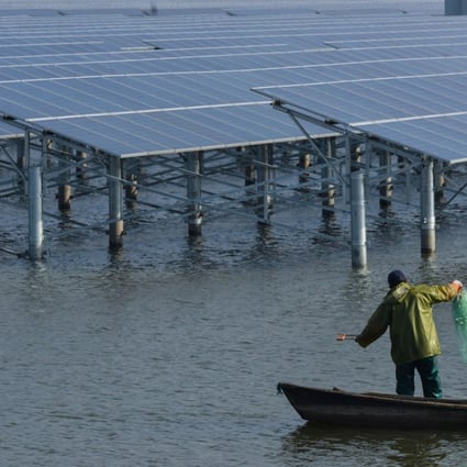 Solar panels installed at a fish farm in China's eastern Zhejiang Province. Beijing has capped the subsidised installation volume allowed at ‘distributed solar farms’, or rooftop panels at factories, fish farms and buildings whose owners can sell volumes in excess of their own consumption to grid operators. Photo: Xinhua