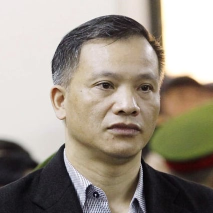 Prominent human rights lawyer Nguyen Van Dai stands trial in Hanoi, Vietnam. He and another alleged dissident were kicked out of the country to Germany. Photo: AP
