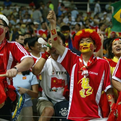Fans cheer during China’s World Cup game against Brazil on June 8, 2002 at the Jeju Stadium in Seogwipo, South Korea. Photo: AFP
