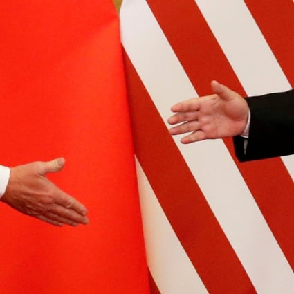 A file picture of US President Donald Trump and China's President Xi Jinping shaking hands at the Great Hall of the People in Beijing last November. Photo: Reuters