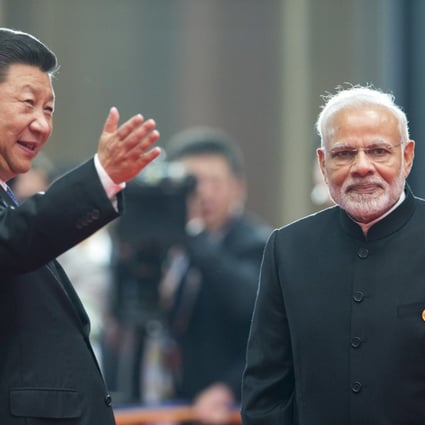 Chinese President Xi Jinping (left) welcomes Indian Prime Minister Narendra Modi for a meeting at the Shanghai Cooperation Organisation summit on Sunday. Photo: AP