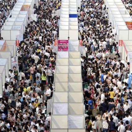 Thousands of job seekers visit booths at a job fair in Chongqing, China. Photo: Reuters