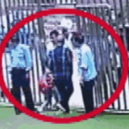 The grandfather is seen in camera footage escorting the wrong child from the kindergarten. Photo: Hangzhou.com.cn