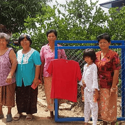 A red shirt is hung in front of a family's house to prevent what they call 'widow ghost' from visiting. Photo: Prasit Tangprasert/ Bangkok Post
