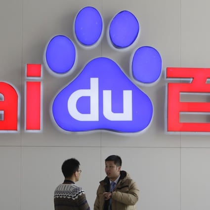 People talk in front of a Baidu's company logo at Baidu's headquarters in Beijing in this file photo taken January 16, 2014. China's biggest internet search company blew past Wall Street's targets with a 34.1 percent jump in quarterly net profit, helped by a surge in mobile revenue. Photo: Reuters