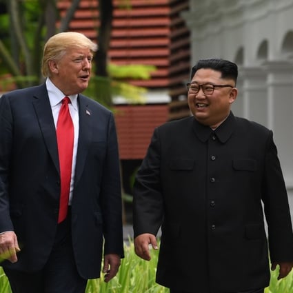 US President Donald Trump and North Korean leader Kim Jong-un during a break in talks at their historic US-North Korea summit in Singapore on Tuesday. Photo: AFP