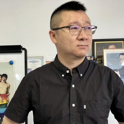 Ma Baoli,who goes by the pseudonym Geng Le, stands in the hallway at the Blued Headquarters in Beijing. Photo: Xinyan Yu