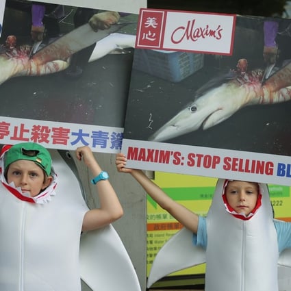Wildlife activists and children from WildAid stage a protest at Maxim’s Restaurant in Central. Photo: Winson Wong