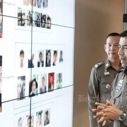 Deputy Tourist Police chief Surachate 'Big Joke' Hakparn shows media his briefing board to press charges against a London-based Facebook user for spreading 'fake news' on the satellite plans (top) and an 'altered photo' of Prime Minister Prayut Chan-o-cha. Photo: Bangkok Post