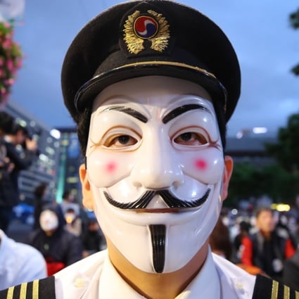 A pilot for Korean Air at a protest against the family that owns the airline. Photo: EPA