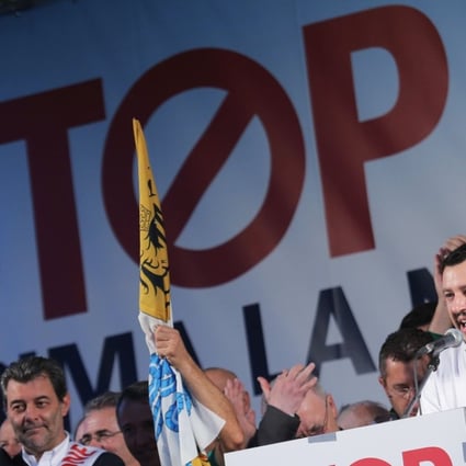Matteo Salvini speaks during an anti-immigration protest in October 2014 in Milan. Long-simmering tensions over the influx of migrants from outside Europe have come to a head in Italy, with the right-wing League allying with the leftist Five Star Movement to rein in immigration and resist pension reforms, with Salvini serving as minister of the interior. Photo: AFP