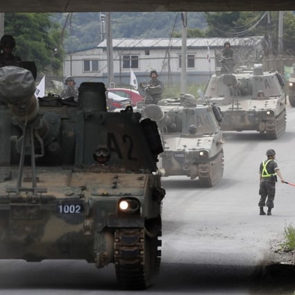 South Korean K-55 self-propelled howitzer artillery relocate after participating in a defence exercise at the Mugeon-ri drill field near the demilitarised zone in Paju, Gyeonggi-do, South Korea, on June 19. In the wake of the Trump-Kim summit, South Korea and the US announced this week that they are suspending their joint military exercise scheduled for August. Photo: EPA-EFE