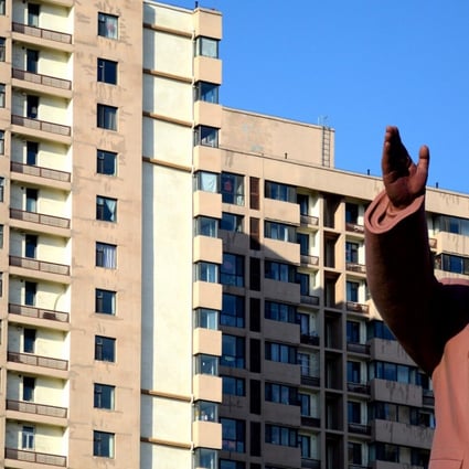 A statue of former Chinese leader Mao Zedong in front of a residential building in Dandong, the border city which handles the lion’s share of bilateral trade flows between China and North Korea. Photo: Reuters