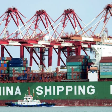 A container ship docks at the port in Qingdao in Shandong province in April. As much as 46 per cent of China’s exports in 2014 were accounted for by foreign-invested enterprises. Of exports to the US, 60 per cent come from these enterprises. Photo: Chinatoppix via AP