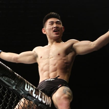 Song Yadong celebrates victory at UFC Singapore. Photos: Lee Li/Asia MMA
