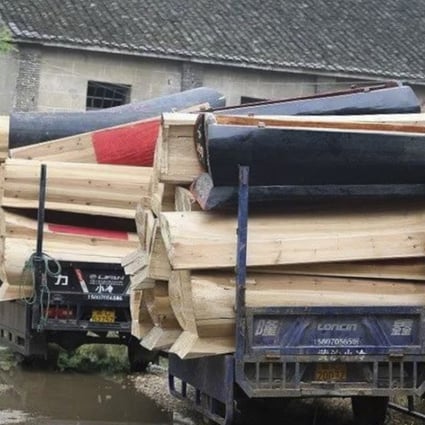Thousands of coffins were handed over in Gaoan county, Jiangxi province, last week as China promotes cremation. Photo: Thepaper.cn