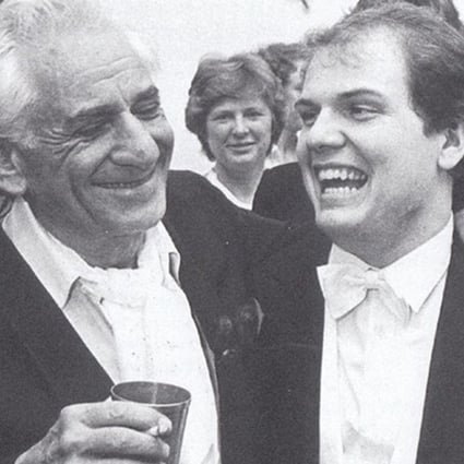 US conductor-composer Leonard Bernstein (left) with Jaap van Zweden, then a young violinist. Van Zweden, music director of the Hong Kong Philharmonic Orchestra, will take up the music directorship of the New York Philharmonic in autumn 2018, the same position that Bernstein took on 60 years ago. Photo: Courtesy of the Hong Kong Philharmonic Orchestra