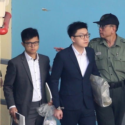 Lo Kin-man (left) and Edward Leung Tin-kei are escorted from the Lai Chi Kok Reception Centre. Photo Sam Tsang