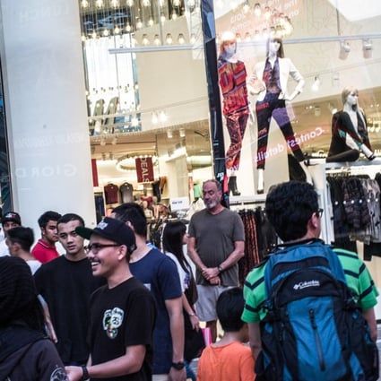 Shoppers outside the H&M store in downtown Kuala Lumpur, Malaysia. Photo: Bloomberg