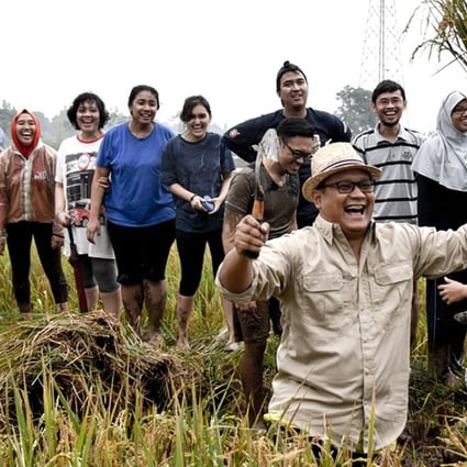 Regi Wahyu, the CEO of HARA, with farmers in Indonesia. HARA is a data exchange platform that is geared towards small farmers. Photo: HARA