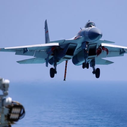 A J-15 prepares to land on China’s only operational aircraft carrier, the Liaoning, during a drill in April. Photo: AFP