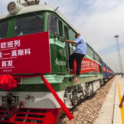 Railway workers prepare the first train for departure from Shijiazhuang, China to Moscow in Shijiazhuang, Hebei province. The launch of the China Railway Express China-Europe line is part of the Belt and Road Initiative. Photo: EPA