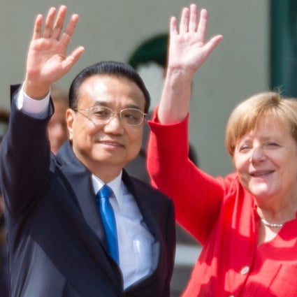 Chinese Premier Li Keqiang and German Chancellor Angela Merkel wave during a military reception in Berlin on Monday. Photo: EPA-EFE