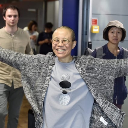 Liu Xia, the widow of Nobel laureate Liu Xiaobo, is all smiles as she arrives at Helsinki Airport in Finland on Tuesday. Photo: AFP