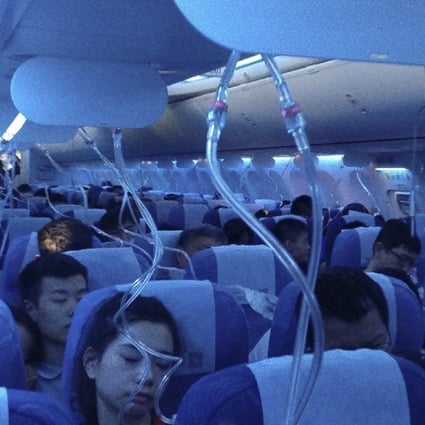 Oxygen masks are deployed aboard Air China flight CA106 from Hong Kong to Dalian in northern China. Photo: Weibo