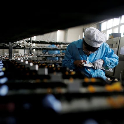 A worker in an electronics factory in Qingdao in Shandong province on January 29, 2018. Photo: REUTERS