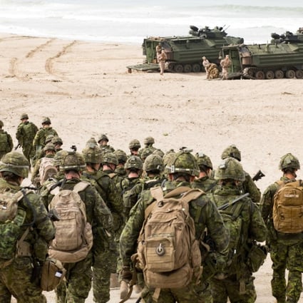 Canadian troops move towards amphibious assault vehicles during the biennial Rim of the Pacific exercise at the Red Beach Training Area, Camp Pendelton, California, on June 27. Photo: Reuters
