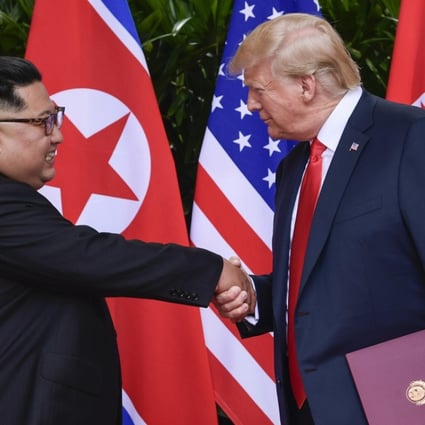 North Korean leader Kim Jong-un and US President Donald Trump shake hands at the conclusion of their meetings in Singapore on June 12. Photo: AP