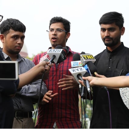 Indian petitioners and LGBT activists Romel Barel, left, Krishna Reddy, centre, and Anwesh Pokkuluri talk to the media after a hearing at the Supreme Court in New Delhi. Photo: EPA