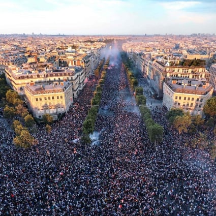 This picture taken from the top of the Arc de Triomphe on Sunday shows people gathering on the Champs-Elysees in Paris after France won the Russia 2018 World Cup final football match against Croatia. Photo: Agence France-Presse