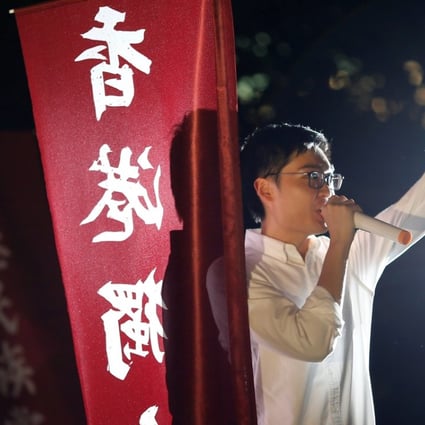 Hong Kong National Party convenor Chan Ho-tin speaks during a protest rally. His party could soon be outlawed. Photo: Reuters