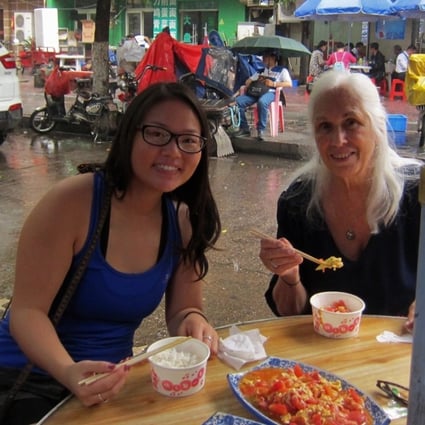 Kathryn Free (left) having lunch with her adoptive mother Carol at a Nanchang street food stall during their return to the city to search for Kathryn’s birth parents.