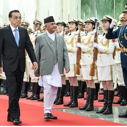 Chinese Premier Li Keqiang holds a welcoming ceremony for Nepal's Prime Minister Khadga Prasad Sharma Oli at the Great Hall of the People before their talks in Beijing. Photo: Xinhua