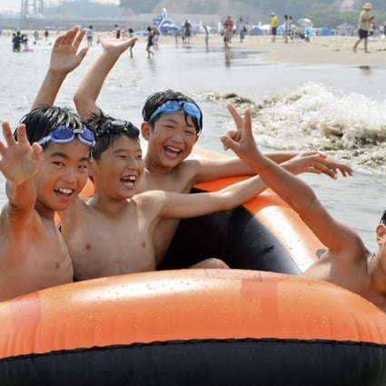 Children play at a beach in Soma, Fukushima Prefecture, which was reopened for the first time since the 2011 earthquake and tsunami. Photo: Kyodo