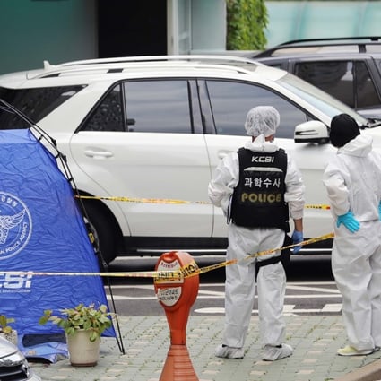 Police inspectors stand next to a tent set up at the spot where Roh Hoe-chan, a three-term lawmaker of South Korea's left-leaning Justice Party, was found dead. Photo: AFP