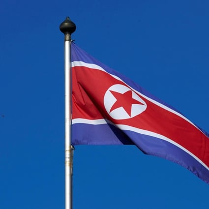 FILE PHOTO – A North Korean flag flies on a mast at the Permanent Mission of North Korea in Geneva October 2, 2014. REUTERS/Denis Balibouse/File Photo