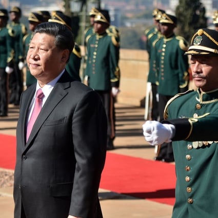 Chinese President Xi Jinping (left) inspects a military honour guard at the Union Building in Pretoria on Tuesday, during his state visit to South Africa. Photo: AFP