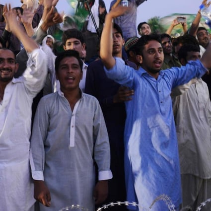 Supporters of Shahbaz Sharif, the younger brother of ousted Pakistani Prime Minister Nawaz Sharif, dance and cheer to songs during an election campaign rally in Pindi Gheb in Pakistan’s Punjab province. Photo: AFP