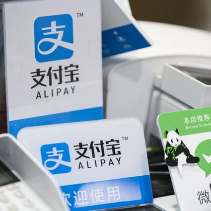 Alipay and Tenpay were each fined 600,000 yuan for breaking the rules on foreign exchange transactions. Photo: Bloomberg