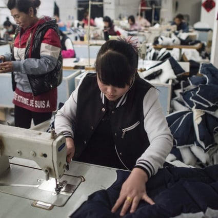 Workers in a textile factory in Anxin, Hebei province on April 5, 2017. Photo: AFP
