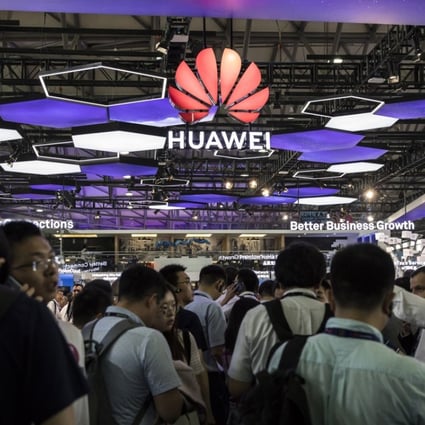 Attendees stand at the Huawei Technologies booth at the Mobile World Congress event in Shanghai, which was held in June this year. Based in Shenzhen, Huawei is the world’s largest telecommunications equipment supplier and China’s biggest smartphone brand. Photo: Bloomberg