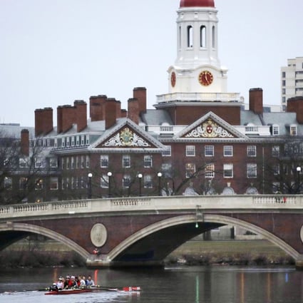 Rowers paddle along the Charles River past the Harvard campus in Cambridge, Massachusetts in March last year. Photo: AP