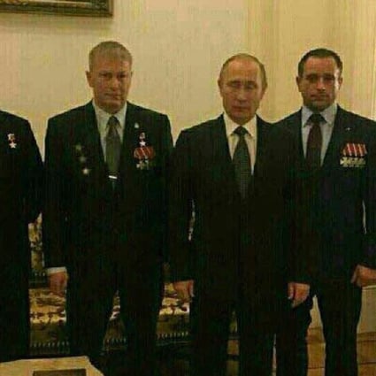 Russian President Vladimir Putin (centre) with supposed members of the Wagner Group of mercenaries, including founder Dmitry Utkin (far right). Photo: Twitter